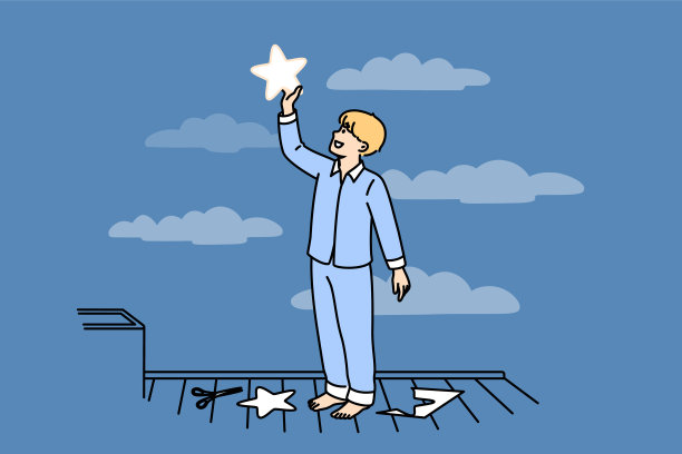 小男孩穿着睡衣，把纸星星放到天上，想着无尽的空间和星系图片下载