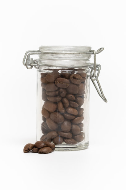 咖啡豆在一个罐子里的工作室照片图片下载
