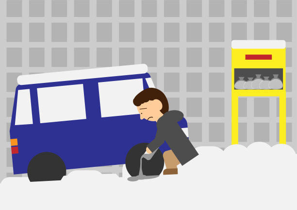 一个人将沙子撒在困在雪坡上的汽车轮胎上的图像材料图片下载