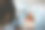 在这幅图片中，一名男子拍摄了一名微笑的女子站在马赛克图案和中英文“长洲”字样前的照片。图片下载