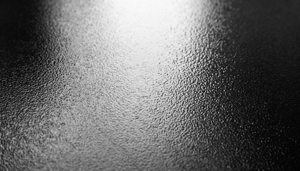 光泽的黑色金属调色板表面，特写照片图片下载