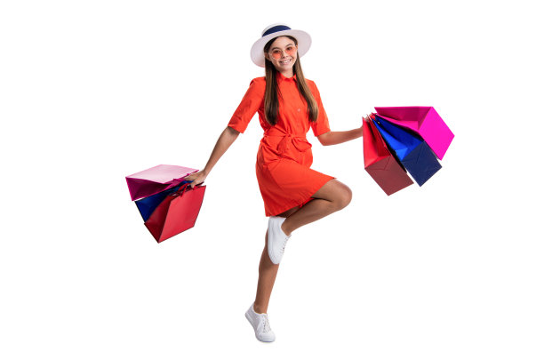 背景中的购物少女照片，手提购物袋图片下载