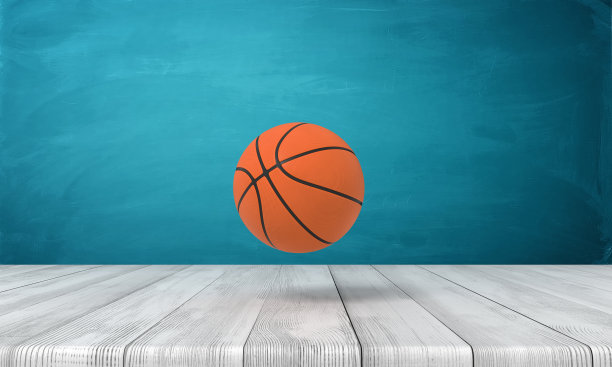 一个篮球在靠近蓝墙的木制表面上的3d渲染。图片下载