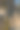 一个黄黑相间的铃铛挂在一根金属杆上图片下载