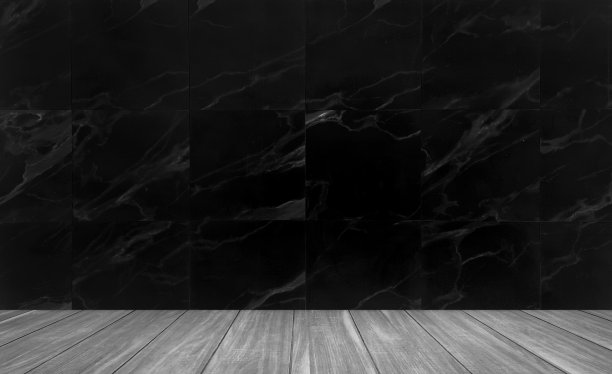 摄影工作室的背景是白色灰色木地板和黑色大理石墙砖。空大理石墙室工作室背景。图片下载