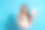 照片欣喜若狂的疯狂女人直发穿着丝绸衬衫拿着礼物盒在手掌孤立的蓝色背景图片下载