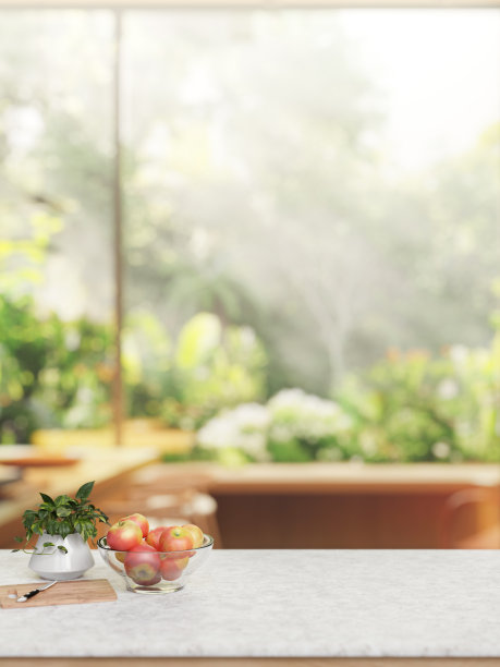白色大理石厨房桌面，背景是花园。图片下载