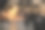 照片剪影树枝在前景与红色黄昏的天空日落场景与多云的天空在开放的海洋与许多波浪图片下载