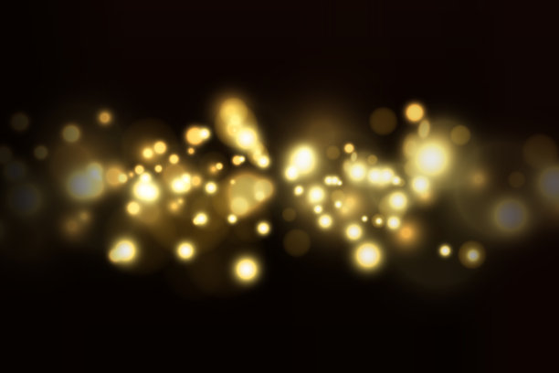 在黑暗背景上模糊闪亮的散景。节日的背景。图片下载