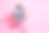 正面的全长照片无忧无虑的女士穿着牛仔装骑购物托盘手臂两侧空的空间孤立的粉红色背景图片下载