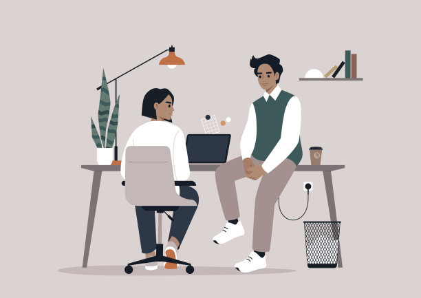 两名员工在他们简约的办公环境中进行轻松的聊天图片下载