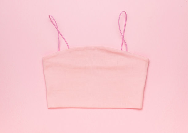 粉色背景上的女性粉色背景。图片下载