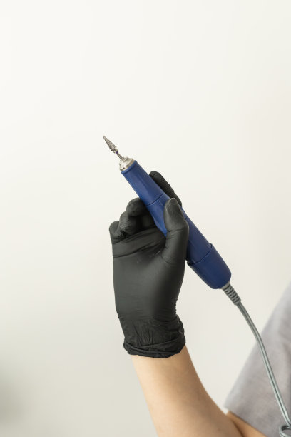 电动指甲锉钻美甲机与弗雷泽近距离在浅色背景与复制空间图片下载