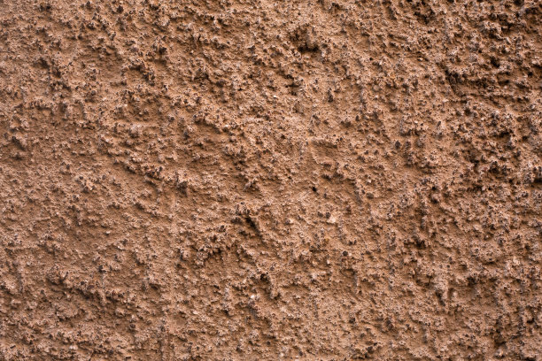 粉彩混凝土外墙。背景图片。用陶土灰泥粉刷老化混凝土表面样品。壁纸纹理图片。前视图。图片下载