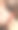 一个女人的垂直照片是插入耳朵橙色无线现代耳机户外。图片下载