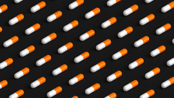 许多白色的橙色胶囊在黑色的背景上，片剂网格。药物，药片，药片顶部平视。3d渲染图图片下载