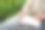 在这张特写照片中，一位亚洲女性坐在自家后院的一张桌子旁，享受着早晨在记事本上写字的放松和个人时间。图片下载