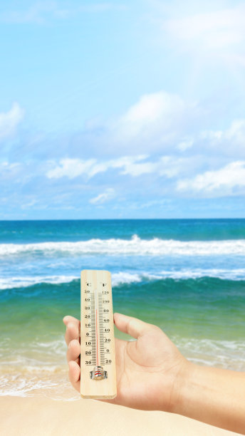 人类手握温度计与热温度图片下载