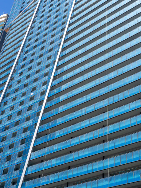 多层建筑概念。房子窗户的背景。房地产行业。供人们居住的地方。图片下载