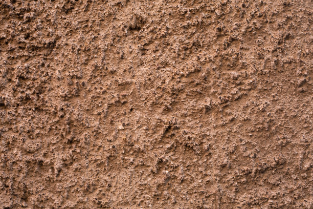 粉彩混凝土外墙。背景图片。用陶土灰泥粉刷老化混凝土表面样品。壁纸纹理图片。前视图。图片下载