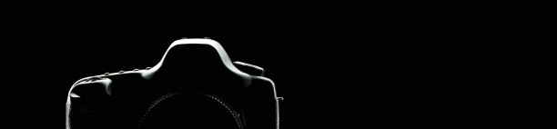 黑色背景上照相机的剪影图片下载