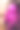神秘的粉红色光芒:一个心形光反射的女人的肖像图片下载
