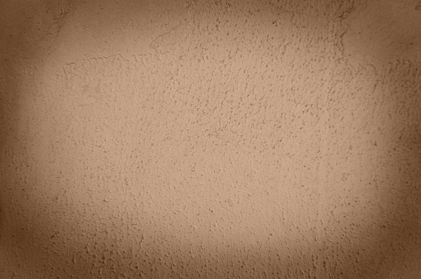 墙壁的纹理是用浅棕色的油漆涂的，粗糙的颗粒从油漆下伸出来。空白背景的艺术品，铭文。图片下载