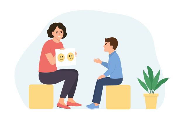 儿童心理学家向男孩展示图片。图片下载