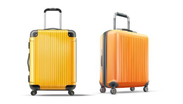 明亮的橙色和黄色硬壳行李箱与轮子和处理的旅行和度假图片下载