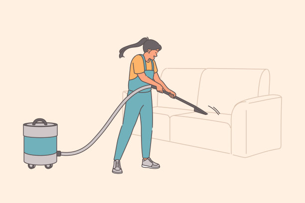 女女佣用吸尘器清理沙发上的灰尘，给软垫家具消毒图片下载