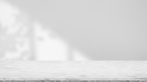 一个有大理石桌子和树叶阴影的时髦房间。白墙背景图片下载