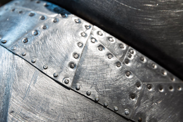 闪亮的金属板铆钉图案，背景照片图片下载
