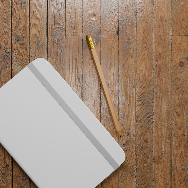 白色的笔记簿和铅笔图片下载