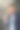 一个穿着西装的年轻商人在办公室里的垂直特写照片，他拿着相机在视频通话，微笑着用手做手势图片下载