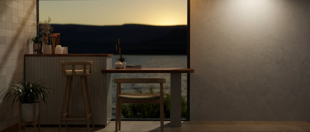 舒适的室内环境与木桌和椅子俯瞰宁静的户外自然景观。图片下载