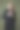 模特拿着夹克的领子，在工作室里以绿色为背景摆姿势。服装品牌的概念照片。时尚西装的酷报价图片下载