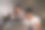 亚洲年轻人晚上在家和妻子在卧室里加班。迷人美丽的妻子穿着睡衣等着丈夫用笔记本电脑工作，在家里睡觉时上网交流。图片下载