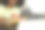 剪短的照片，微笑的年轻女子在客厅使用笔记本电脑，在笔记本上写字图片下载