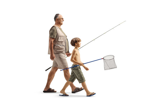 成熟男人和一个男孩拿着钓鱼竿的全身照图片下载