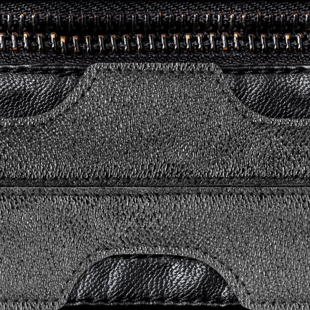 无缝4k照片纹理的黑色缝制皮革修补与皮革华丽的条纹和拉链。图片下载