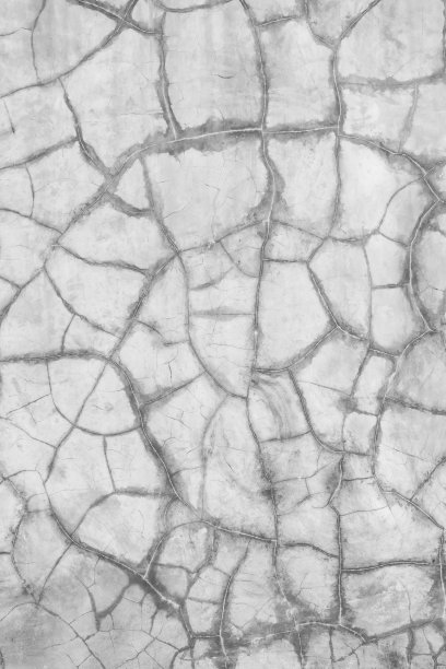 这张照片是一面墙的特写，上面有裂缝和洞图片下载