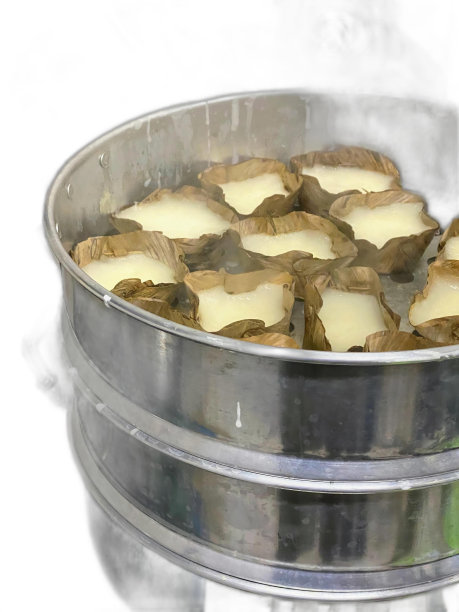 一张装满饼干和糖霜的金属容器的照片。图片下载