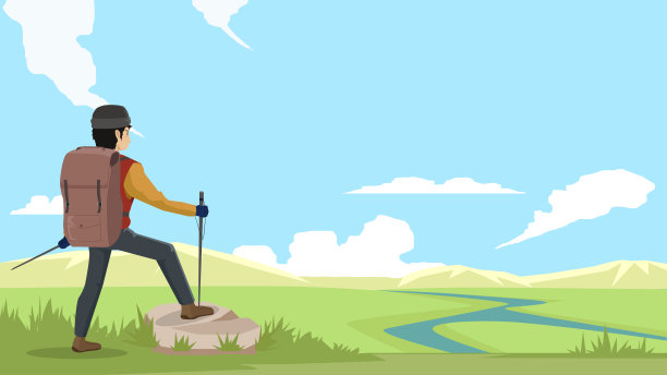 徒步旅行者站在山顶的岩石上。图片下载