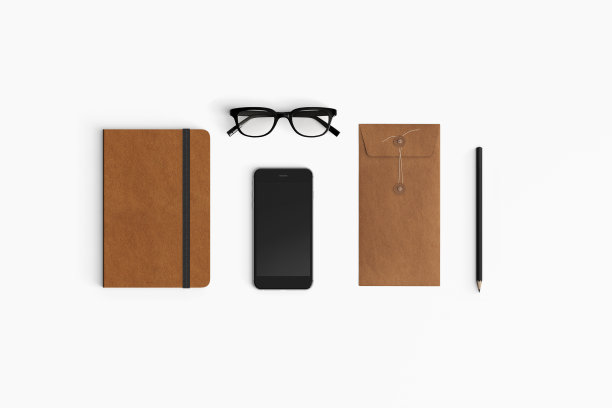 手机、书和眼镜在白色背景上的正上方照片图片下载