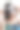年轻女子用羽毛调整威尼斯狂欢节面具图片下载