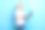 照片正面老人拿着使用无线上网本写电子邮件孤立在蓝色背景图片下载