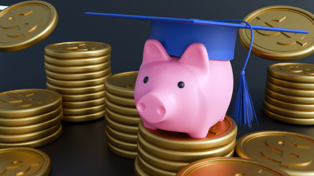 一个戴着毕业帽、拿着金币的粉色储蓄罐图片下载