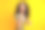 照片积极华丽漂亮的女孩与波浪发型穿着条纹t恤直接对你孤立的黄色背景图片下载