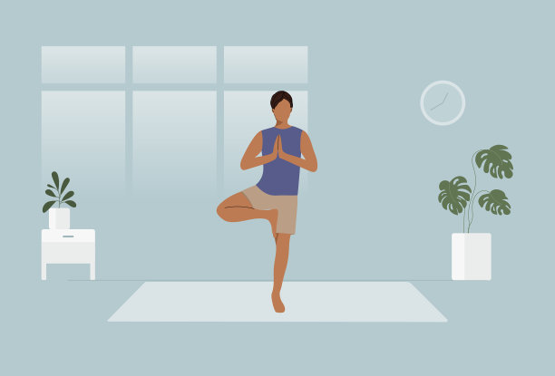 男子在平静的家庭环境中练习树式瑜伽图片下载