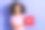 照片肖像迷人的年轻女子抱着心脏图标穿着时尚的粉红色衣服孤立的紫色背景图片下载